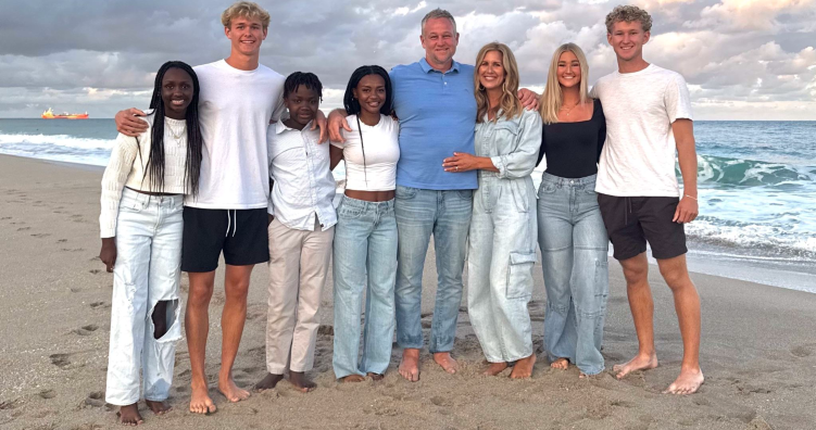 Fisher family and three kids from Arrows + Hope at the beach