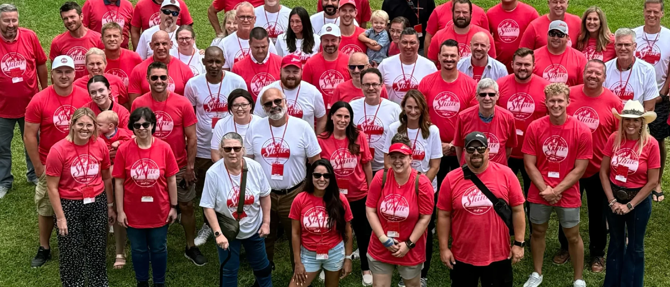 The Shine team and Franchise owners smiling together.