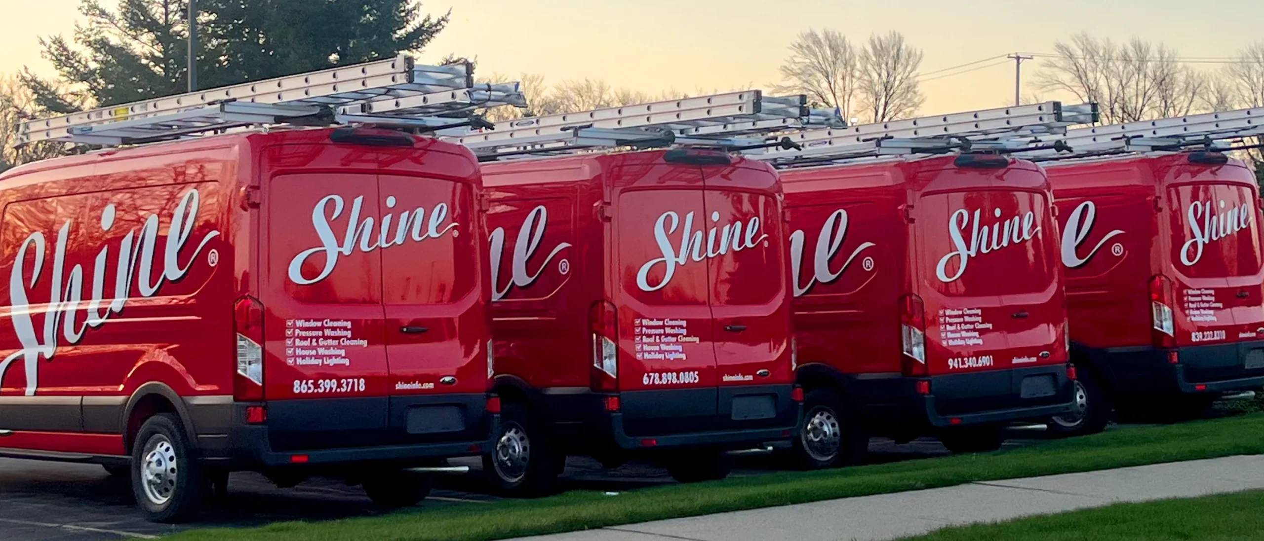 Shine Franchise service vehicles lined up, representing a scalable premium property care franchise.