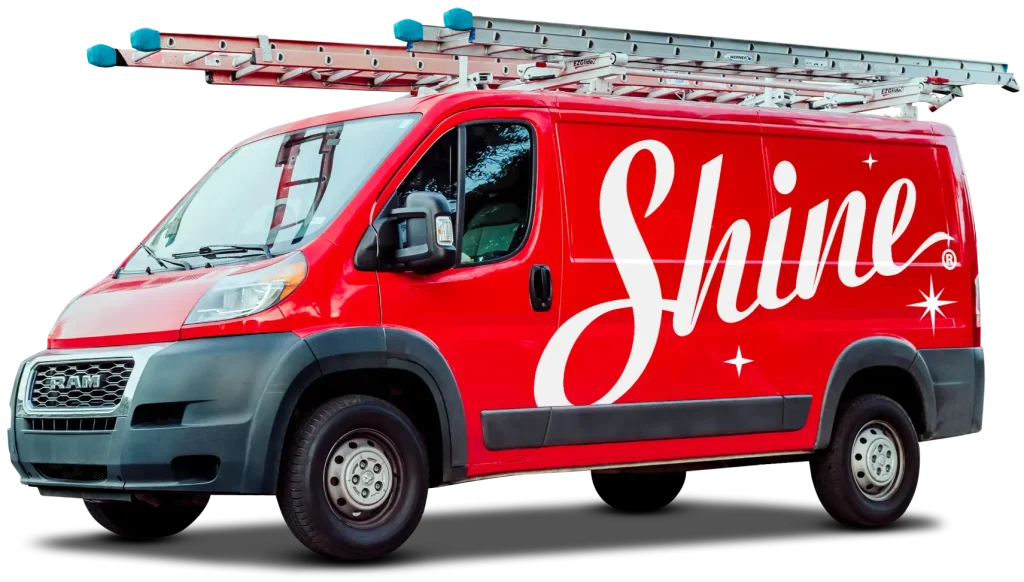 Shine branded service van placed on a red graphic background