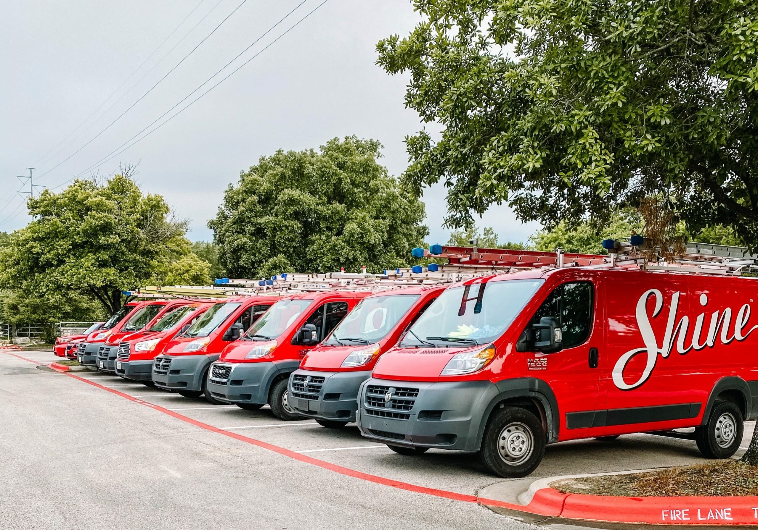 A lineup of Shine branded vehicles